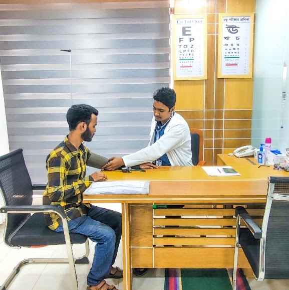 Clinical doctor performing physical assessment at Meem Medical Center